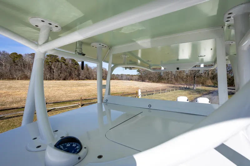 Slide: The Image of 2005 French Yachts 34 Center Console, view from deck overlooking a rural landscape. - 32