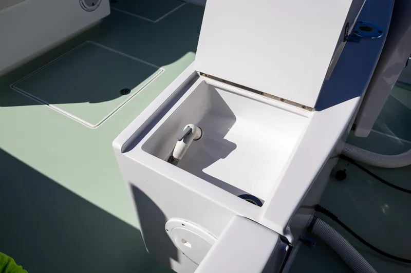 Slide: The Image of Open storage compartment on 2005 French Yachts 34 Center Console boat deck. - 35
