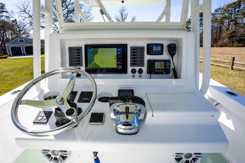 Slide: The Image of 2005 French Yachts 34 Center Console dashboard with navigation and control systems. - 4