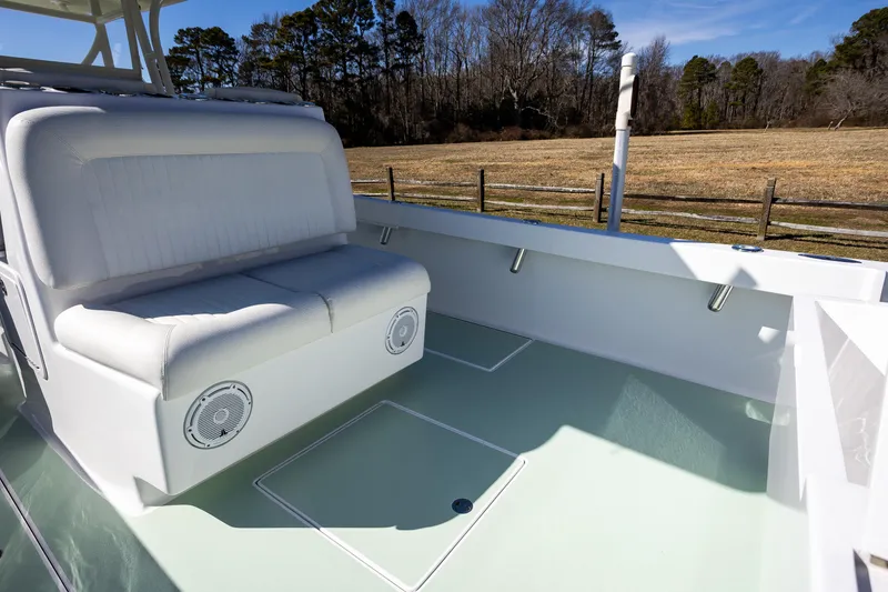 Slide: The Image of 2005 French Yachts 34 Center Console interior with white seating and outdoor view. - 41