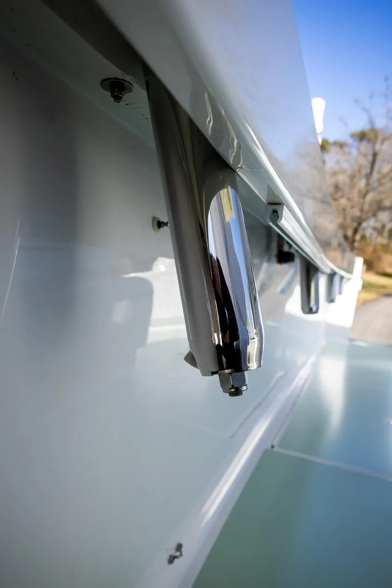 Slide: The Image of Close-up of a 2005 French Yachts 34 Center Console boat detail, showcasing sleek design. - 49