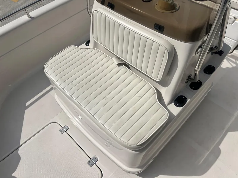 Slide: The Image of White seating on a 2001 Fishmaster 19 CC boat, featuring a clean, striped design. - 10