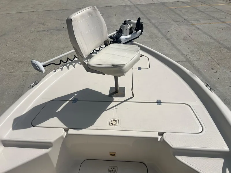 Slide: The Image of 2001 Fishmaster 19 CC boat with swivel seat and trolling motor on deck. - 12