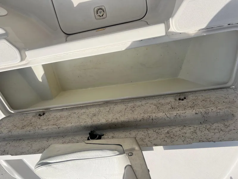 Slide: The Image of Open storage compartment on a 2001 Fishmaster 19 CC boat. - 5