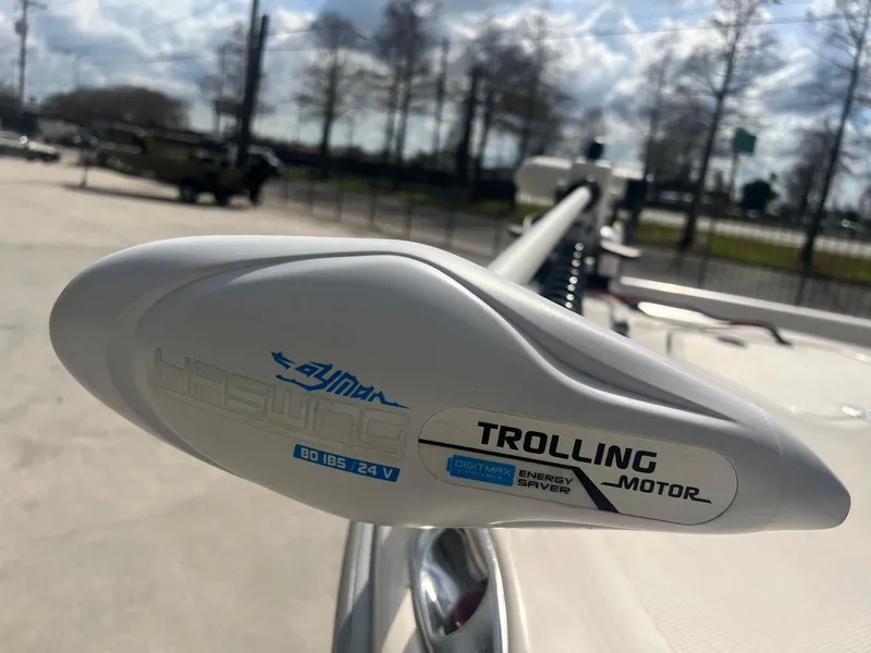 Slide: The Image of Trolling motor on a 2001 Fishmaster 19 CC boat, outdoor setting. - 6
