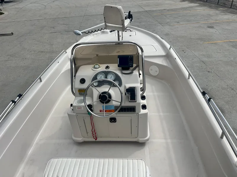 Slide: The Image of 2001 Fishmaster 19 CC boat interior with steering console and navigation equipment. - 8
