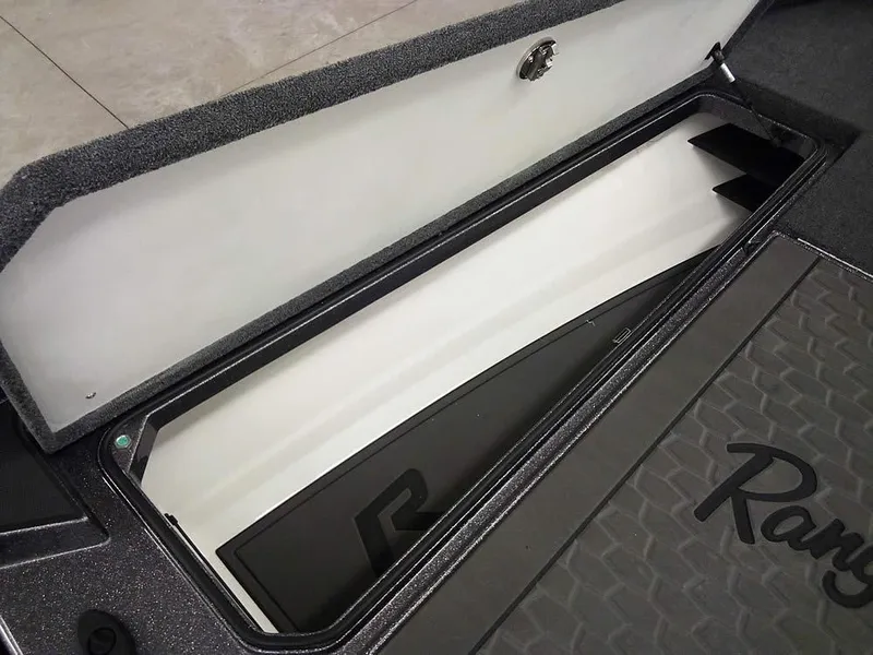 Slide: The Image of 2025 Ranger Z521R Garmin Ranger Cup Equipped storage compartment, open lid, interior view. - 16