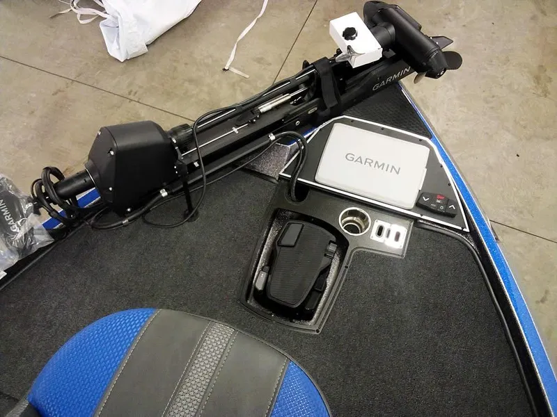 Slide: The Image of 2025 Ranger Z521R boat with Garmin equipment, featuring a trolling motor and control panel. - 18