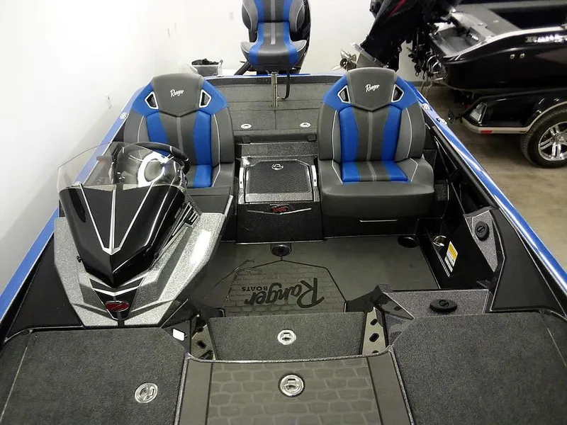 Slide: The Image of 2025 Ranger Z521R Garmin Ranger Cup boat interior with blue and gray seating. - 21