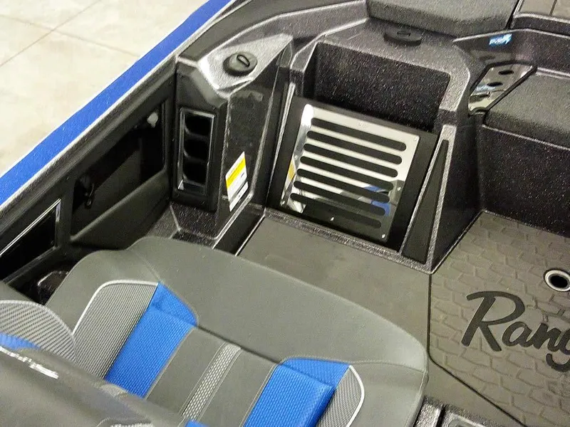 Slide: The Image of 2025 Ranger Z521R Garmin Ranger Cup interior with blue and gray seating. - 22