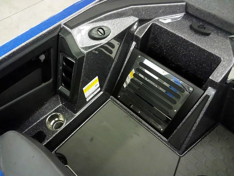 Slide: The Image of 2025 Ranger Z521R Garmin Ranger Cup boat interior with storage compartments and cup holder. - 23