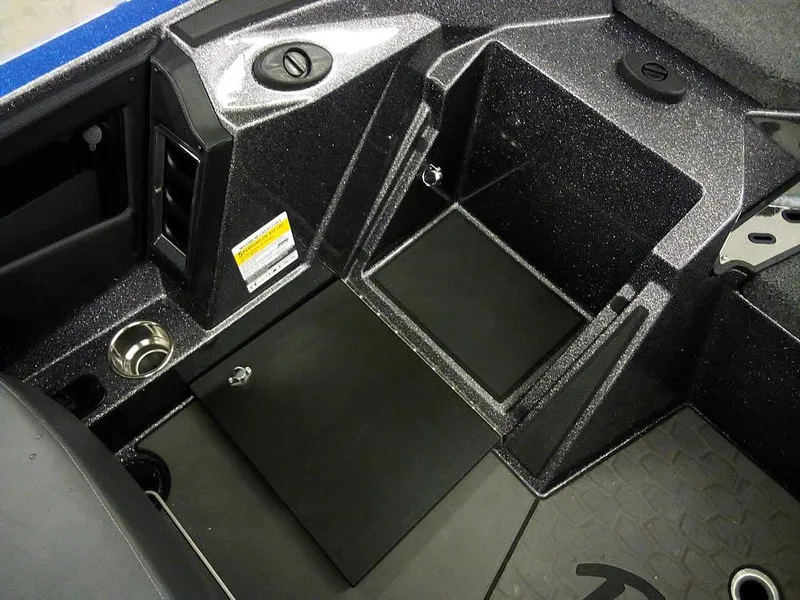 Slide: The Image of 2025 Ranger Z521R Garmin Ranger Cup Equipped boat interior, featuring storage compartments and cup holder. - 24