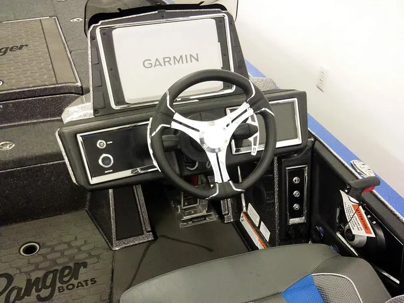 Slide: The Image of 2025 Ranger Z521R Garmin Ranger Cup Equipped boat dashboard with steering wheel and Garmin display. - 27