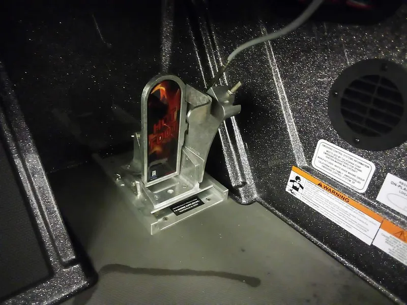 Slide: The Image of 2025 Ranger Z521R Garmin Ranger Cup Equipped interior detail with mounted device and warning labels. - 28