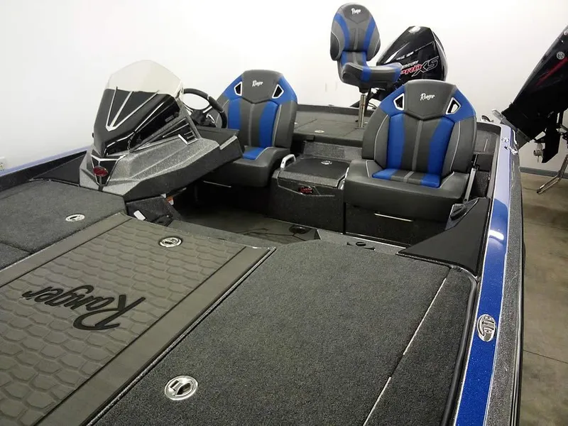 Slide: The Image of 2025 Ranger Z521R Garmin Ranger Cup Equipped boat interior with blue and black seating. - 7