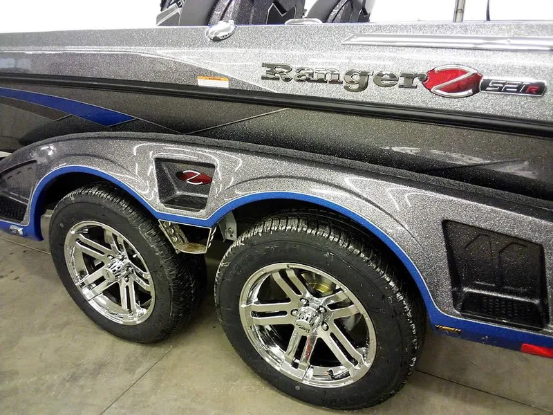 Slide: The Image of 2025 Ranger Z521R Garmin Ranger Cup boat with sleek design and shiny chrome wheels. - 8