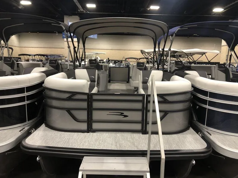 The Image of 2025 Bennington S Quad Bench 22 SSR pontoon boat with spacious seating and sleek design. - 1