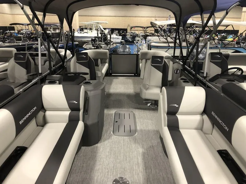 Slide: The Image of 2025 Bennington S Quad Bench 22 SSR pontoon boat interior with spacious seating. - 3