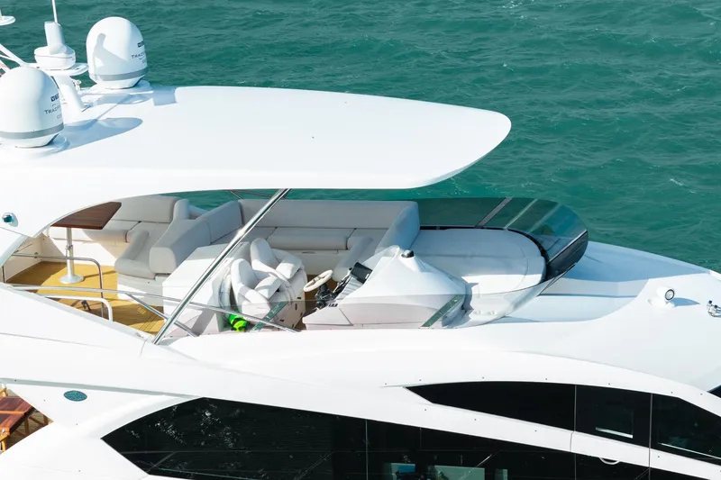 Slide: The Image of Sunseeker Manhattan 65 yacht, 2016 model, cruising on blue waters. - 19