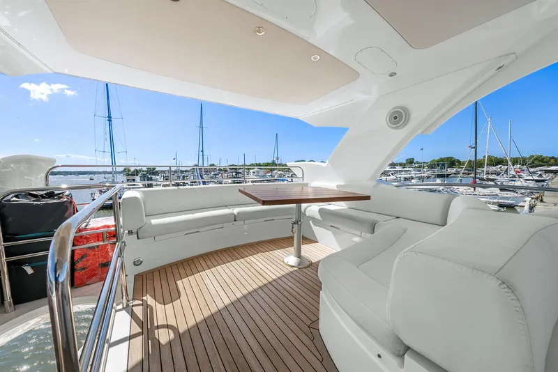 Slide: The Image of Luxurious 2016 Sunseeker Manhattan 65 yacht with spacious deck and marina view. - 32