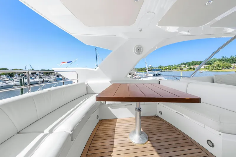 Slide: The Image of Luxurious Sunseeker Manhattan 65 yacht interior with elegant seating and wooden table, 2016 model. - 33