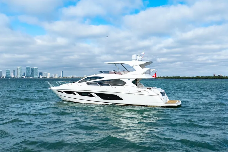 Slide: The Image of 2016 Sunseeker Manhattan 65 yacht cruising on open water. - 6