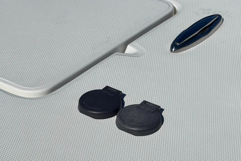 Slide: The Image of 2025 World Cat 325 CC deck with black fittings and textured surface. - 16