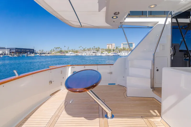 Slide: The Image of 2008 Ocean Alexander Pilothouse yacht deck with ocean view and marina backdrop. - 16