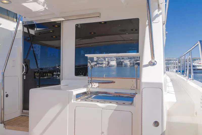 Slide: The Image of 2008 Ocean Alexander Pilothouse yacht with outdoor grill and marina view. - 18