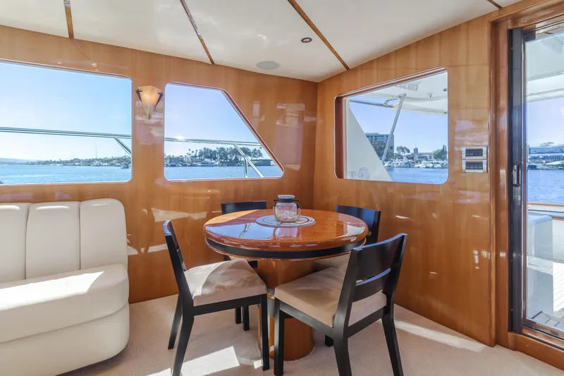 Slide: The Image of Luxurious 2008 Ocean Alexander Pilothouse interior with dining area and scenic ocean views. - 23