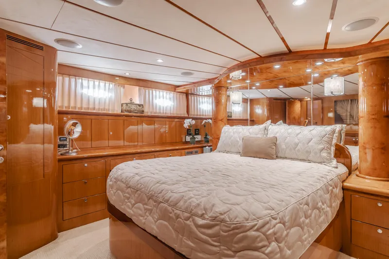 Slide: The Image of Luxurious bedroom in 2008 Ocean Alexander Pilothouse yacht with elegant wood finishes. - 29