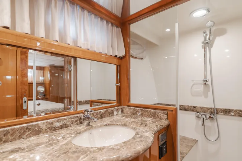 Slide: The Image of Luxurious bathroom in 2008 Ocean Alexander Pilothouse yacht with marble countertop and shower. - 32