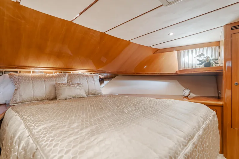 Slide: The Image of Luxurious bedroom in 2008 Ocean Alexander Pilothouse yacht with elegant bedding and wood finishes. - 33