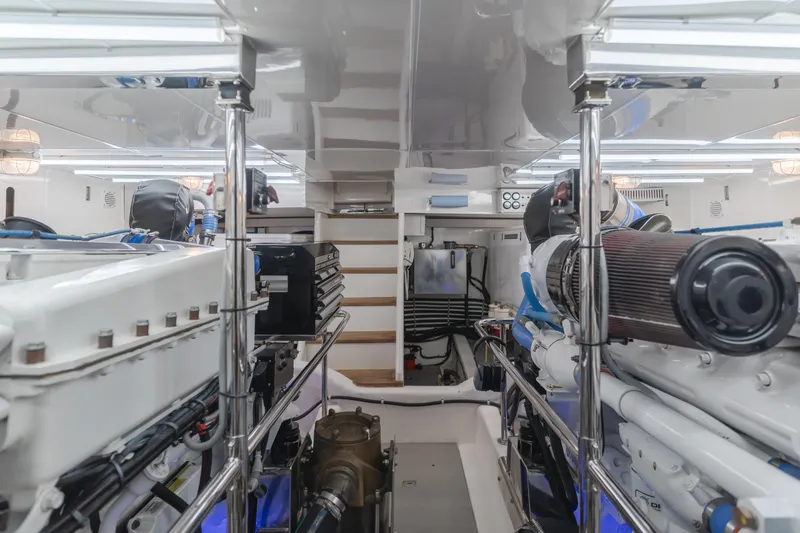 Slide: The Image of Engine room of 2008 Ocean Alexander Pilothouse yacht, showcasing dual engines and mechanical systems. - 38