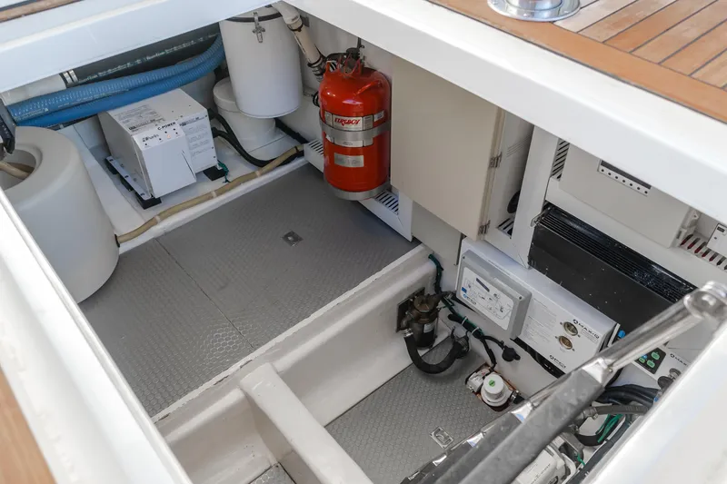 Slide: The Image of Engine room of 2008 Ocean Alexander Pilothouse with equipment and fire extinguisher. - 45