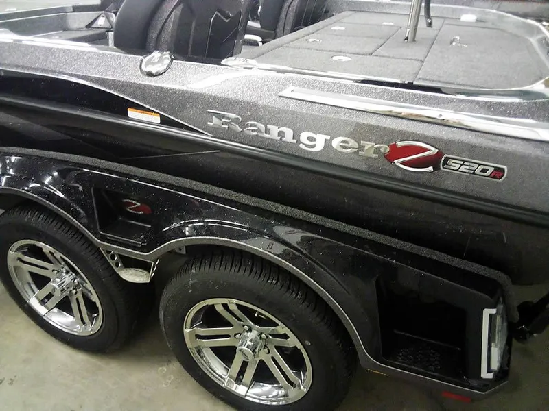 Slide: The Image of 2025 Ranger Z520R Ranger Cup Equipped boat, black exterior, dual wheels, sleek design. - 13