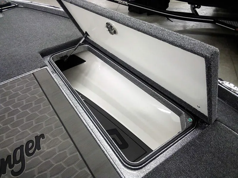Slide: The Image of 2025 Ranger Z520R boat storage compartment, open lid, interior view. - 19