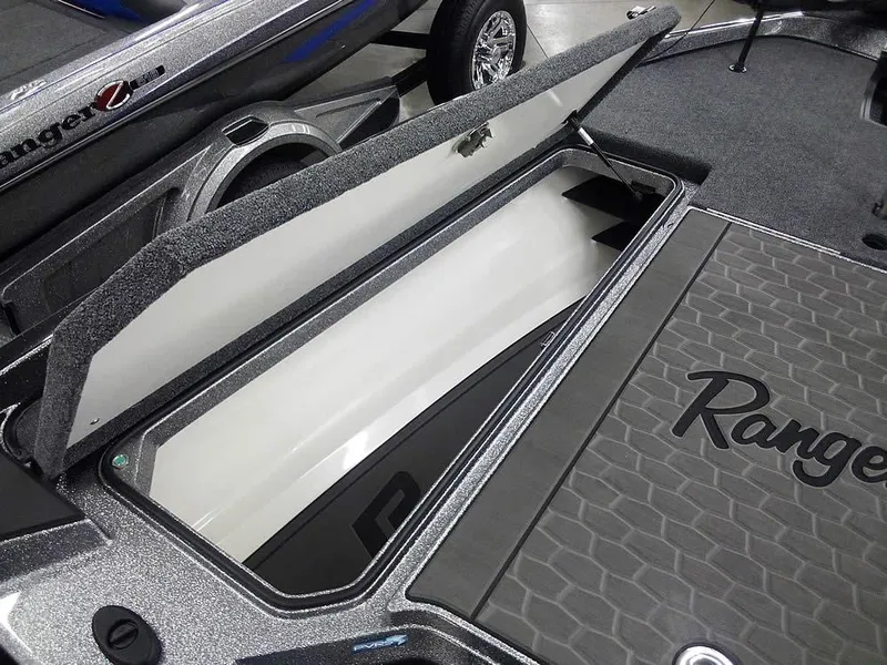 Slide: The Image of 2025 Ranger Z520R Ranger Cup Equipped boat storage compartment open, showcasing interior design. - 20