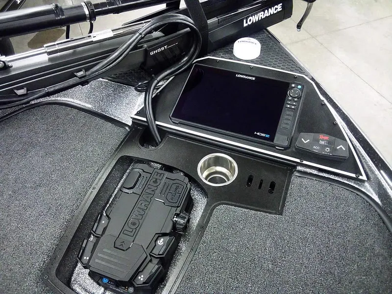 Slide: The Image of 2025 Ranger Z520R boat dashboard with Lowrance electronics and cup holder. - 23