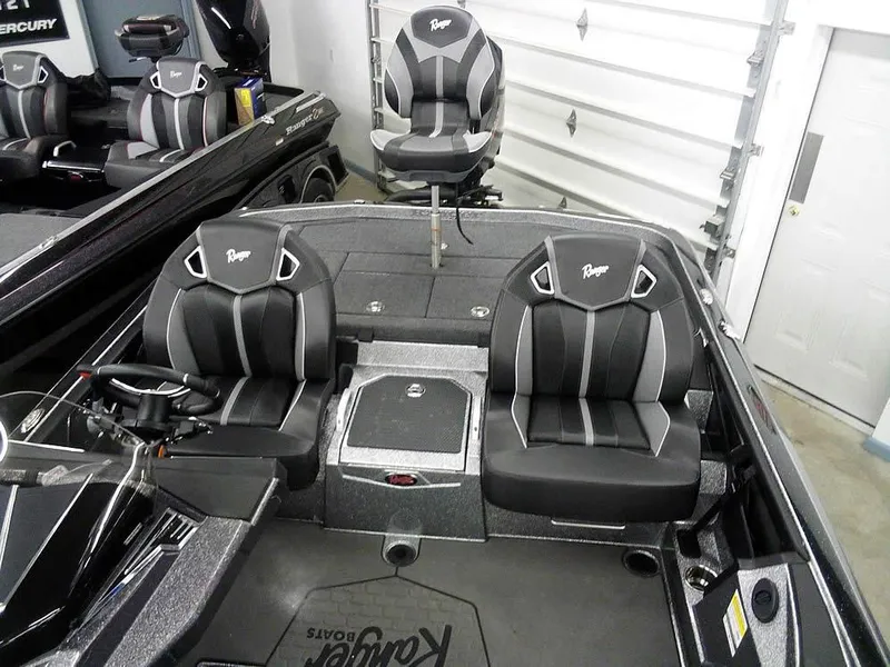 Slide: The Image of 2025 Ranger Z520R Ranger Cup Equipped boat interior with three black seats. - 24