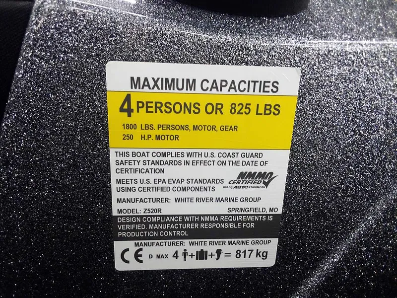 Slide: The Image of 2025 Ranger Z520R capacity label: 4 persons, 825 lbs, 250 HP motor compliance details. - 28