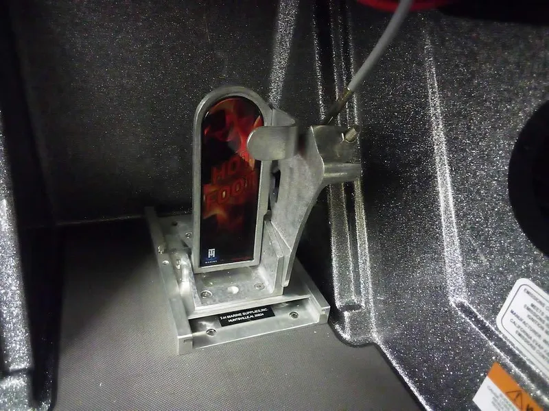 Slide: The Image of 2025 Ranger Z520R Ranger Cup Equipped boat component, featuring a metallic mechanism in a storage compartment. - 30