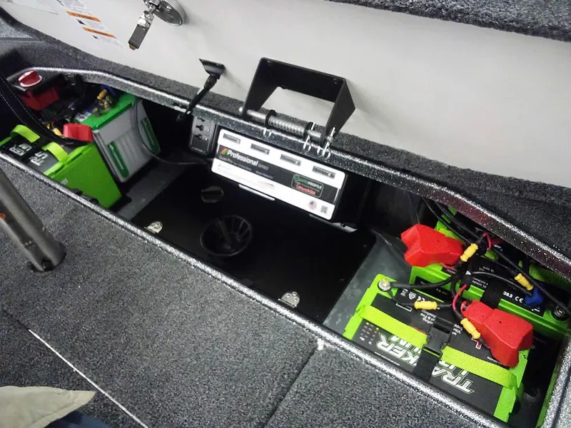 Slide: The Image of 2025 Ranger Z520R Ranger Cup Equipped boat battery compartment with organized wiring and storage. - 37