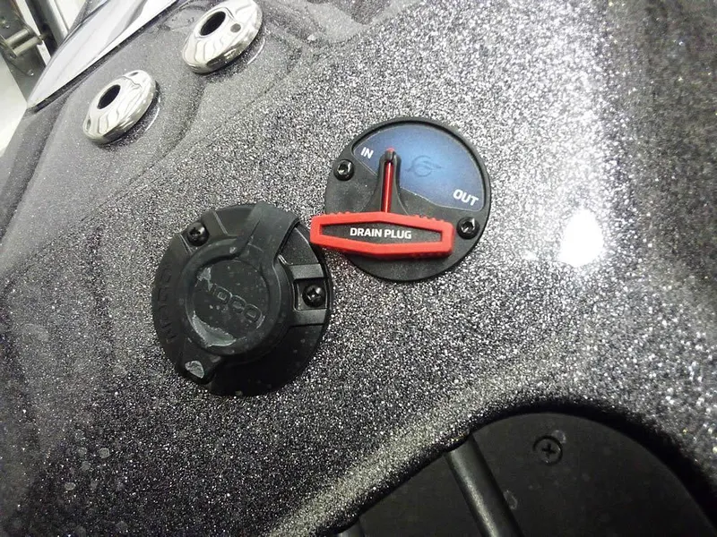 Slide: The Image of 2025 Ranger Z520R boat drain plug and control panel close-up. - 39