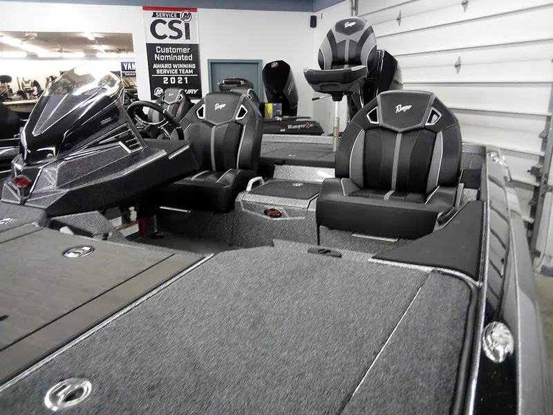 Slide: The Image of 2025 Ranger Z520R Ranger Cup Equipped boat interior with sleek black seating and modern dashboard. - 8
