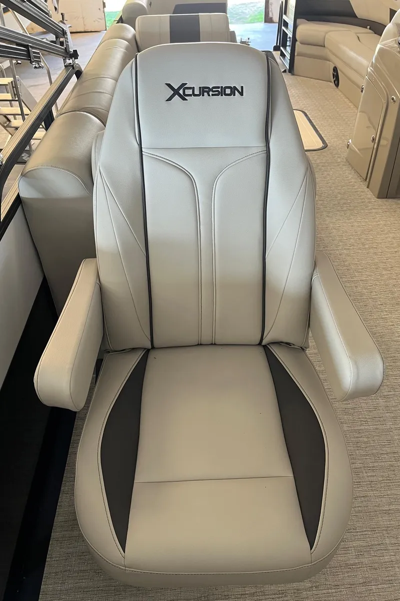 Slide: The Image of 2023 Xcursion 243 PFX boat seat, beige and black design, luxurious and comfortable. - 13