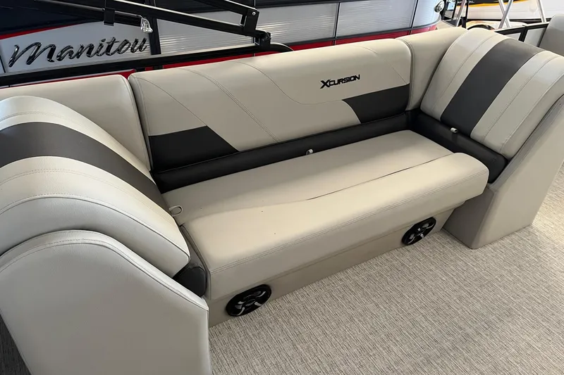 Slide: The Image of 2023 Xcursion 243 PFX boat seating with beige and black upholstery. - 14