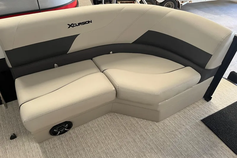 Slide: The Image of 2023 Xcursion 243 PFX boat seating with beige and black upholstery. - 7