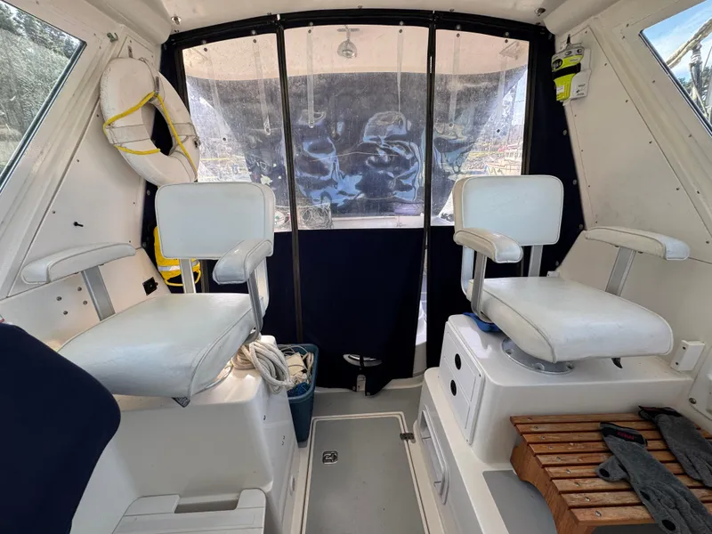 Slide: The Image of Interior of 2005 Albin 28 Tournament Express boat with seating and life preserver. - 13