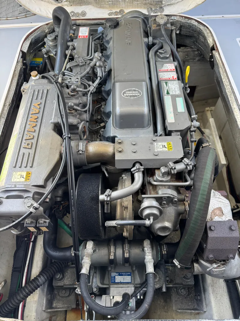 Slide: The Image of 2005 Albin 28 Tournament Express engine, detailed view of Yanmar marine diesel engine components. - 15
